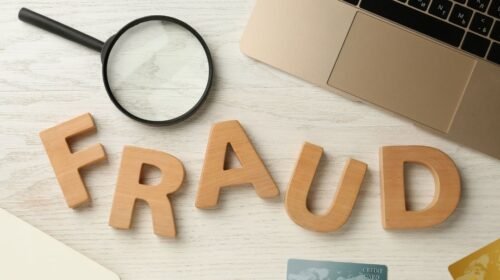 image with laptop and letters that spell fraud