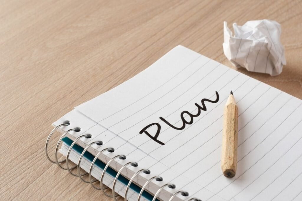 Notebook with the work "plan" written