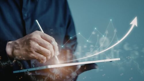 man viewing an investment portfolio on a screen